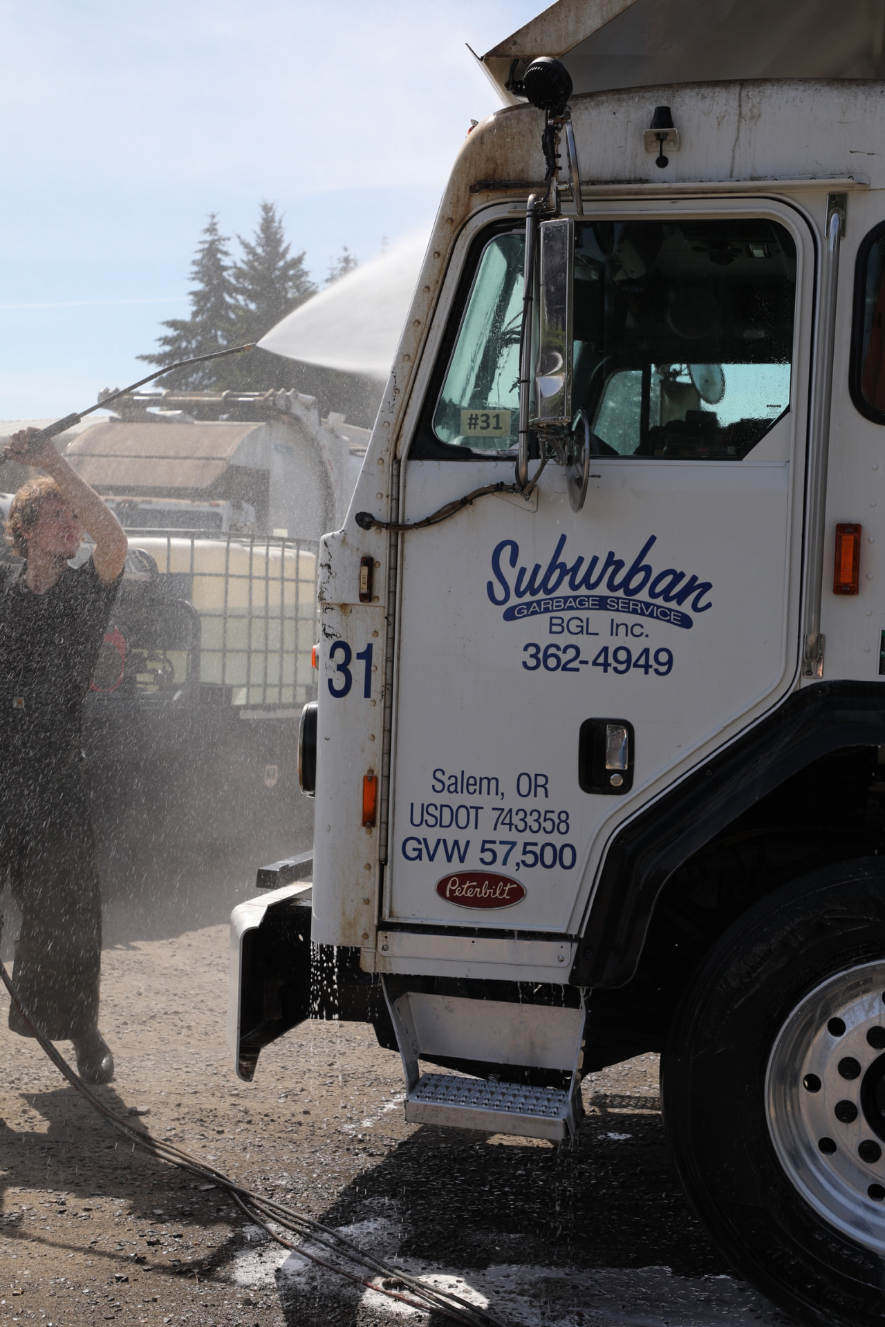 Fleet garbage truck being washed